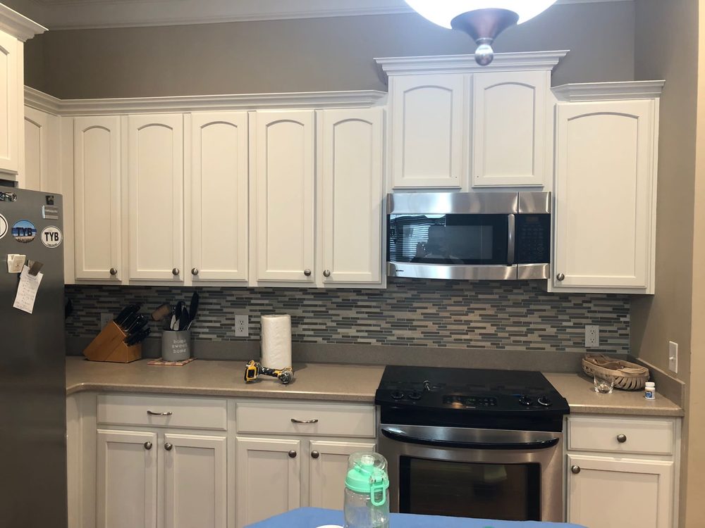 White repainted kitchen with mosaic backsplash