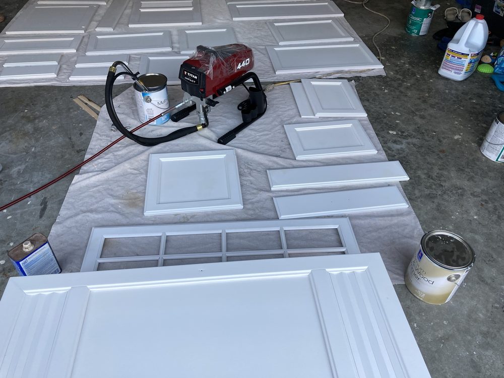 Cabinet doors being sprayed in the shop